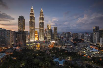 Petronas towers in Kuala Lumpur, Malaysia by nightfall