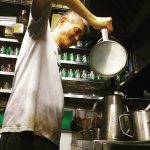 Man pouring "sock pulled coffee"in a kopitiam