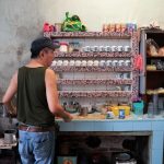 Man preparing coffee in the Kong Thai Lai Kopitiam